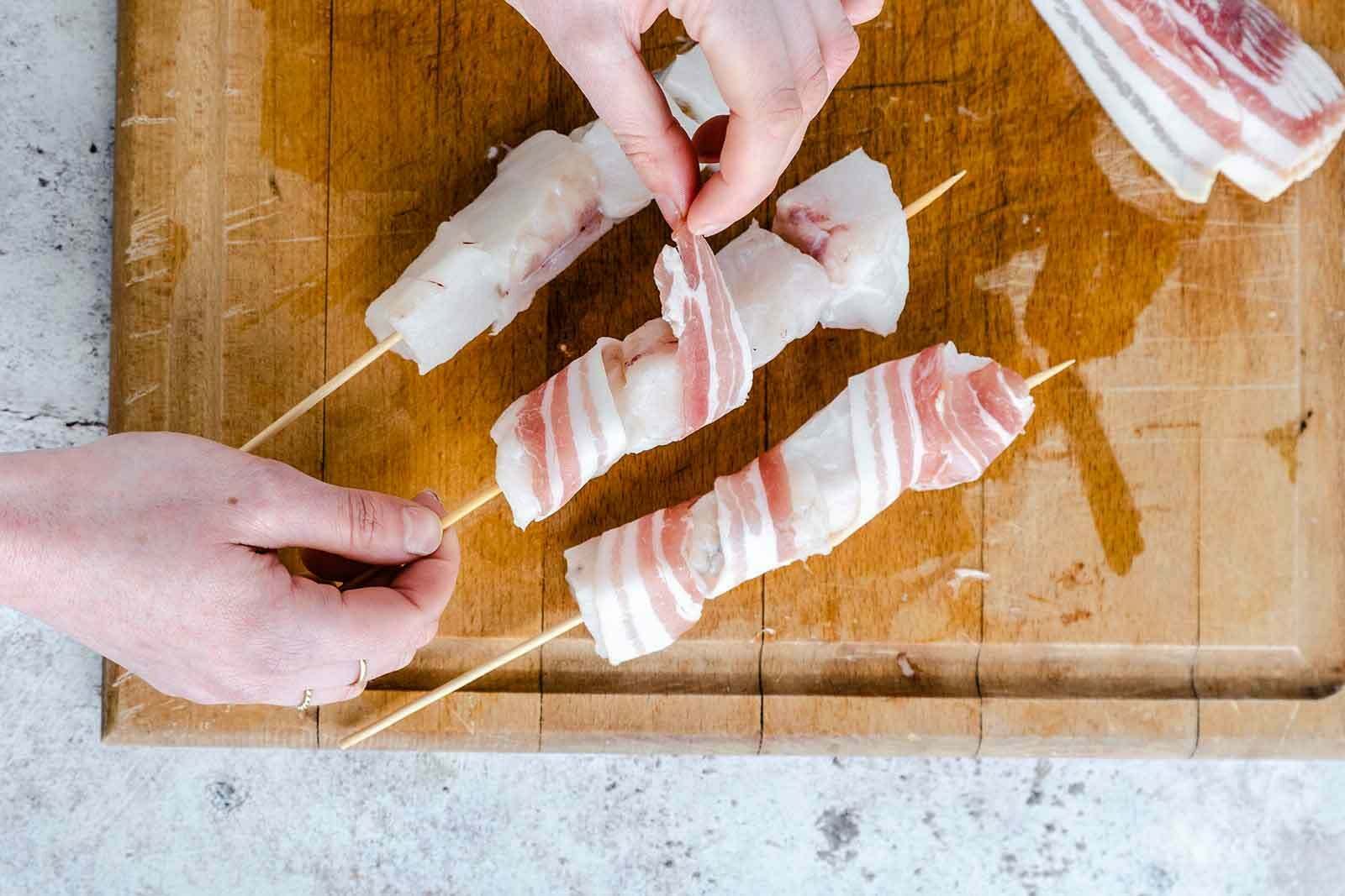 Monkfish and bacon kebabs with minty peas and salsa verde