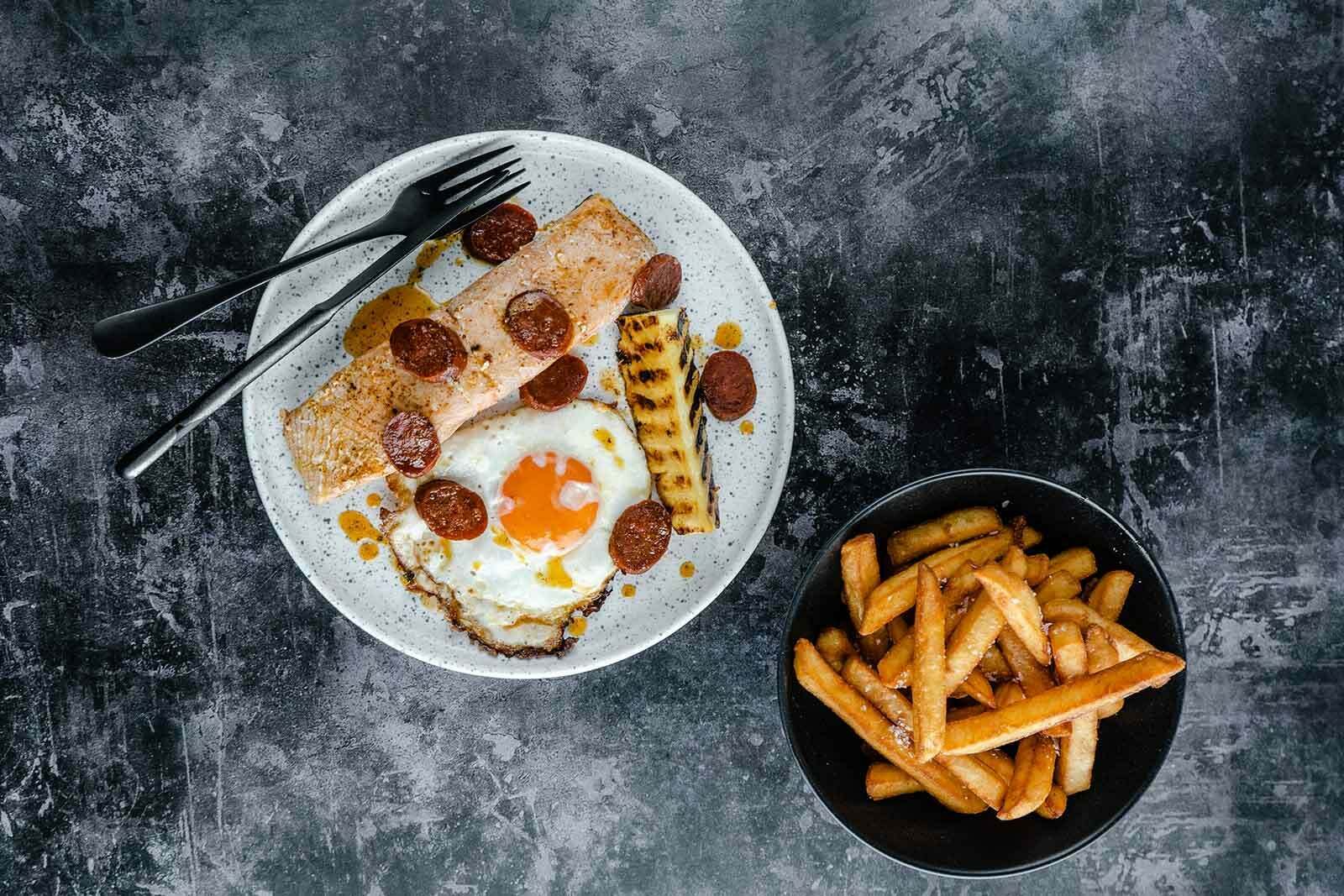 Salmon fillets with egg and chips