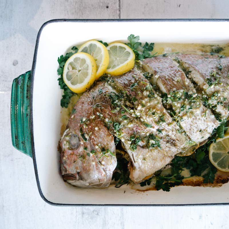 Whole Baked Snapper- Herb stuffed with Garlic and Dill Butter Sauce 