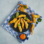 Tempura Prawns displayed on a black plate with a sriracha mayonnaise dip